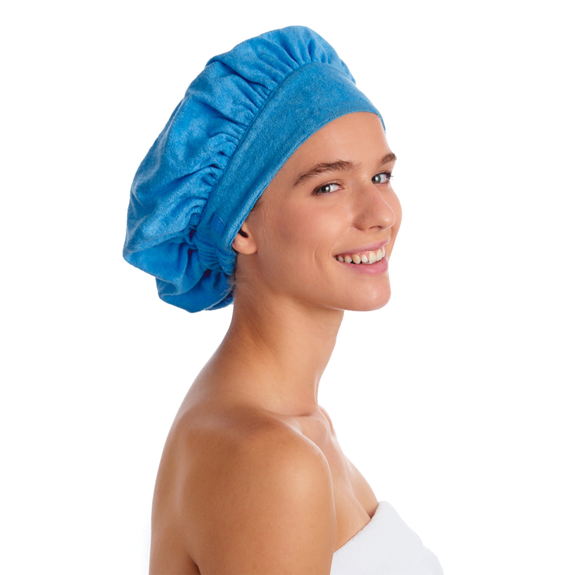 A BEAUTIFUL WOMAN WEARING THE REVERSED SIDE OF THE TIARA SHOWER CAP PAISLEY DESIGN.